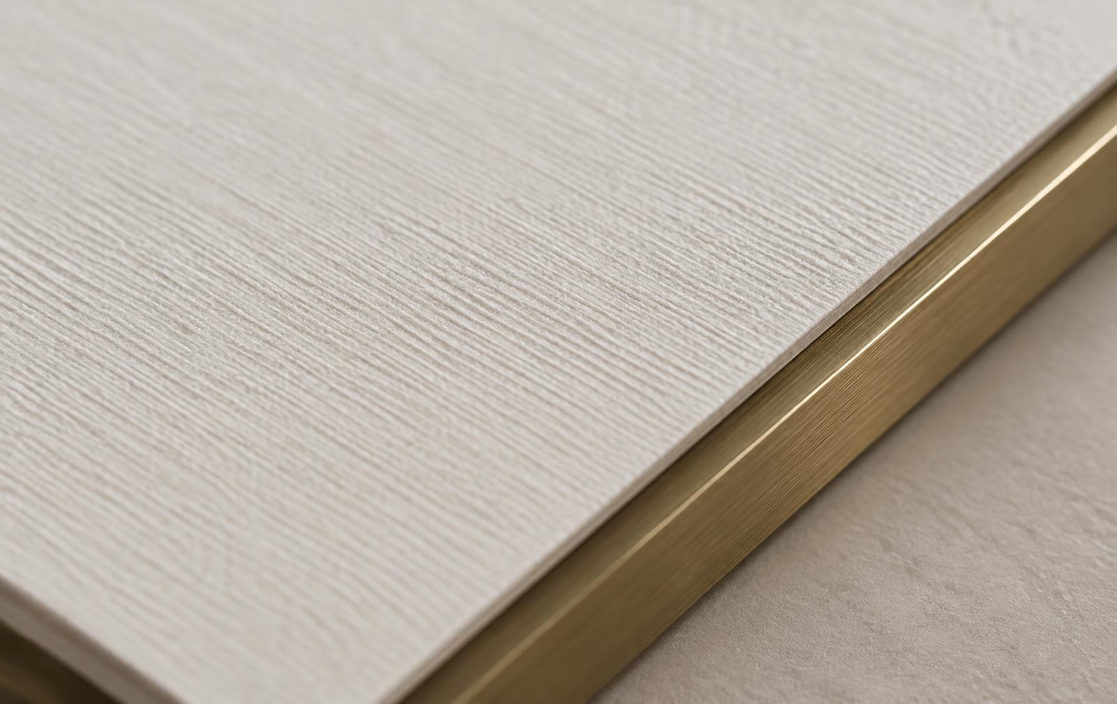 Fine ivory paper with a brass edge